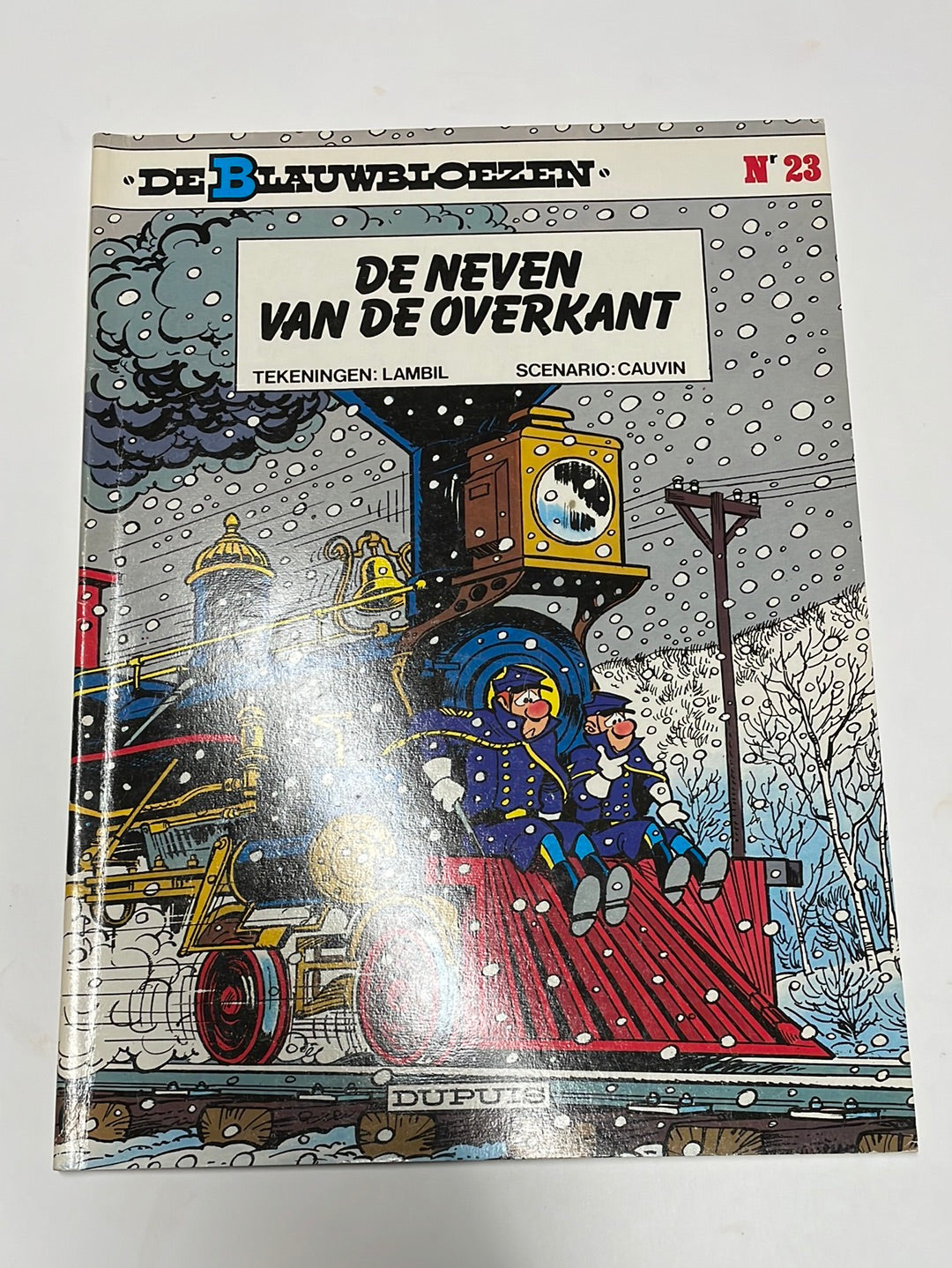 De Blauwbloezen- De neven aan de overkant, nummer 23